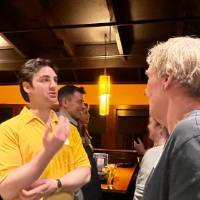 Alums talking at the event together.